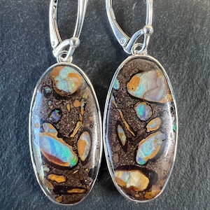 Boulder opal lever back drop earrings set in sterling silver. Yowah Australia boulder opal dangle earrings.