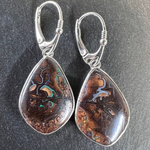 Freeform teardrop Koroit boulder opal drop earrings with sterling silver settings and lever backs. Natural boulder opal drop earrings.