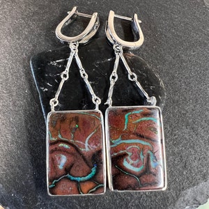 Rectangle Yowah boulder opal earrings with chain drops set in sterling silver. Boulder opals set in sterling silver with lever back closures