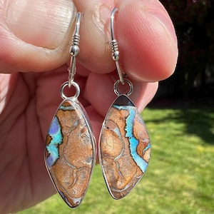 Bright boulder opal drop earrings with decorative lever backs and sterling silver settings. Handmade one-of-kind earrings.