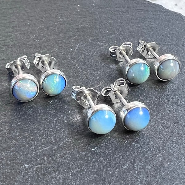 Australian white opal stud earrings set in sterling silver. Minimalist natural, Coober Pedy opal earrings set in sterling silver.