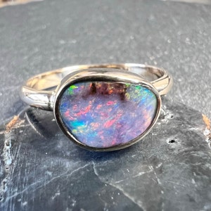 Boulder opal showing beautiful glowing pastels. Australian opal ring set in solid 14k yellow gold.