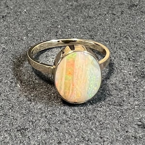 Fall Colors in this 3.16 Carat Australian Boulder Opal Ring set in 14K Yellow Gold. US Size 6-3/4