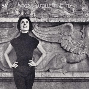 May include: A monochrome image of a woman in a black outfit, comprising a short-sleeved top and trousers. She stands with hands on hips against a textured wall with relief carvings. The image includes the text "PATONS LUCILLE FINE PLY".