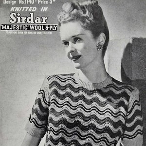 May include: A black and white striped sweater with a wavy pattern. The sweater has short sleeves and a round neckline. The sweater is knitted in Sirdar "Majestic" wool 3-ply.