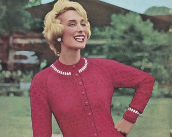 May include: A red cardigan sweater with white trim around the neckline and cuffs. The sweater has a button-up front and a fitted silhouette.
