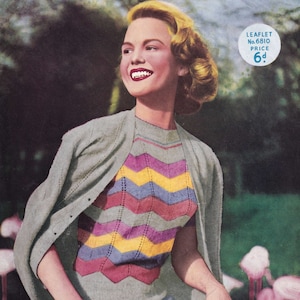 May include: A woman wearing a gray cardigan over a multi-colored chevron patterned sweater. The sweater has stripes of pink, yellow, purple, and gray. The woman is smiling and has blonde hair. The image has a vintage feel.