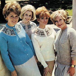 May include: Four women wearing different colored cardigans with a patterned design around the neckline. The cardigans are button-up and have long sleeves.