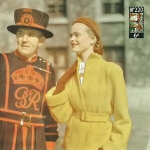 May include: Vintage image featuring a woman in a yellow jacket and a man in a traditional uniform. The woman wears a brown hat and gloves, carrying a brown purse. The text "Hand Knitwear in Lavenda" is visible. A postage stamp is in the upper right corner.