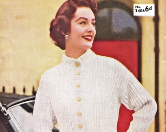 May include: A white knitted cardigan with a high collar and button closure. The cardigan is worn by a woman with red hair and a pearl earring. The image includes the text "No. 3406 6d".