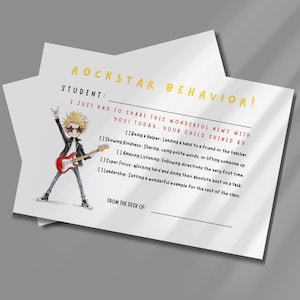 May include: A white rectangular note card titled Rockstar Behavior in yellow text. It features a cartoon of a spiky-haired person playing a red electric guitar. The text includes student and teacher lines, plus checkboxes for positive behaviors like being a helper, showing kindness, amazing listening, super focus, and leadership.