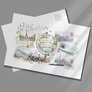 May include: A white postcard featuring a watercolor illustration of a globe with a banner reading WORLD POSTCARD DAY. Surrounding the globe are small paintings of the Eiffel Tower, a coastal town, a beach, and a city skyline, plus a camera and pen.