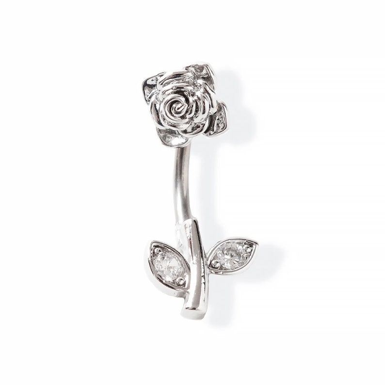 Navel piercing with flower, steel and brass. image 1