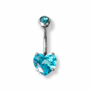 May include: A silver belly button ring with a blue heart-shaped gem.