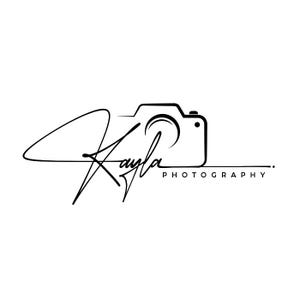 May include: A black line art logo featuring the name Kayla in a cursive script font integrated with a minimalist camera outline. The word PHOTOGRAPHY is printed in a clean sans-serif font underneath the camera body on the right side.