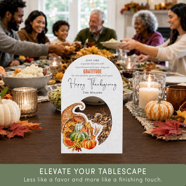 May include: A white arched card with the text: JUST LIKE a garden blooms with nourishment and care, may our GRATITUDE for one another grow wildly each year. Happy Thanksgiving The Millers. A cutout reveals a cornucopia illustration with pumpkins.