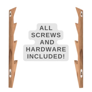 May include: Two wooden wall hooks with a branch-like design. The hooks are made of natural wood and have a light brown color. The text "ALL SCREWS AND HARDWARE INCLUDED!" is displayed in white text on a gray background.