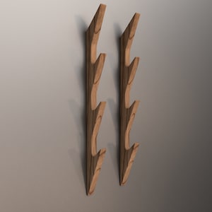 May include: Two wooden wall mounted coat racks with five hooks each. The racks are made of light brown wood and have a natural finish.