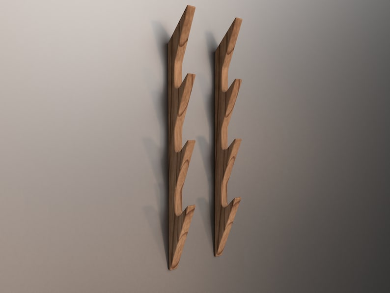May include: Two wooden wall mounted coat racks with five hooks each. The racks are made of light brown wood and have a natural finish.
