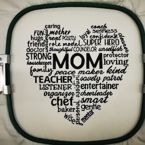 May include: A black and white embroidery design of a heart with the word "MOM" in the center. The heart is surrounded by words describing the qualities of a mother, such as "caring", "fun", "strong", "teacher", "peacemaker", "protector", "loving", "kind", "smart", "gentle", and "wise".