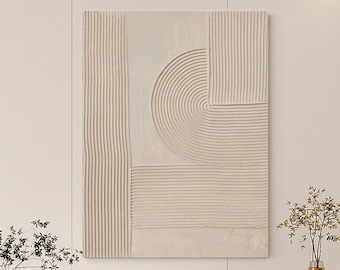 May include: Abstract wall art with a beige and white color scheme. The art features a geometric design with raised lines and a curved shape.