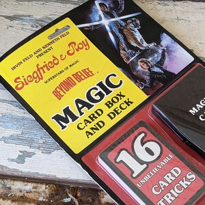 May include: A 1982 Siegfried & Roy Beyond Belief magic card box and deck set in original blister packaging. The yellow header features the performers, while the red insert displays 16 Unbelievable Card Tricks and a black plastic card box.