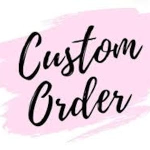 May include: The words "Custom Order" in elegant black script are displayed against a soft pink watercolor-style background. The text is centered, creating a visually appealing design for personalized requests.