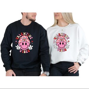 Valentine Vibes Sweatshirt: Smiley Face Heart Tee