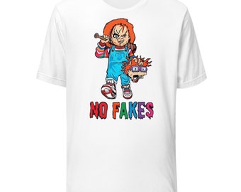 May include: White t-shirt with a cartoon image of a red-haired character holding a baseball bat and a second character's head. The text "NO FAKES" is printed in rainbow colors below the image.