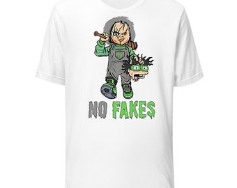 May include: White t-shirt with a green and black illustration of a cartoon character holding a baseball bat and a severed head. The text "NO FAKES" is printed in green below the illustration.