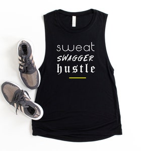 May include: Black sleeveless tank top with the text "sweat swagger hustle" in white with a yellow line underneath.