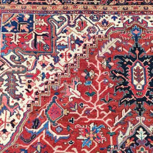 May include: A red, blue, and white Persian rug with intricate floral and geometric patterns. The rug has a central medallion and a border with a repeating design.