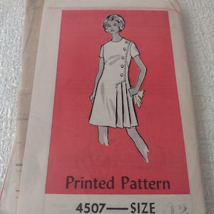 May include: Vintage sewing pattern for a dress, printed on a red background. The pattern number is 4507 and the size is 12.