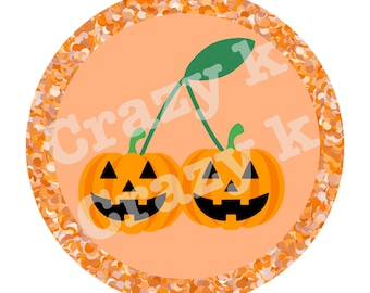 May include: A round orange graphic with a Halloween theme. Two orange jack-o'-lanterns are connected by green stems and a green leaf. The background is peach with an orange glitter border. The text "Crazy K" is visible.
