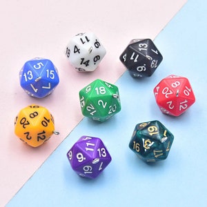 May include: Set of ten 20-sided dice in various colors, including red, green, blue, purple, white, black, and yellow. Each die has black numbers and a silver loop.