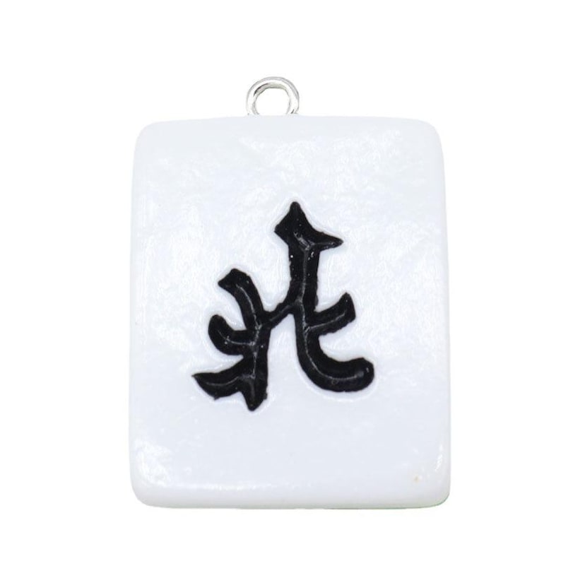 May include: A white rectangular charm with a black Chinese character. The charm has a silver loop at the top for attaching to a necklace or bracelet. The design is simple and clean, with a focus on the bold black symbol.