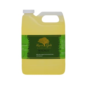 May include: A gallon jug of Liquid Gold Walnut Oil. The label is green with gold lettering and features a tree. The text on the label reads "100% pure organic for hair skin & body multi purpose".