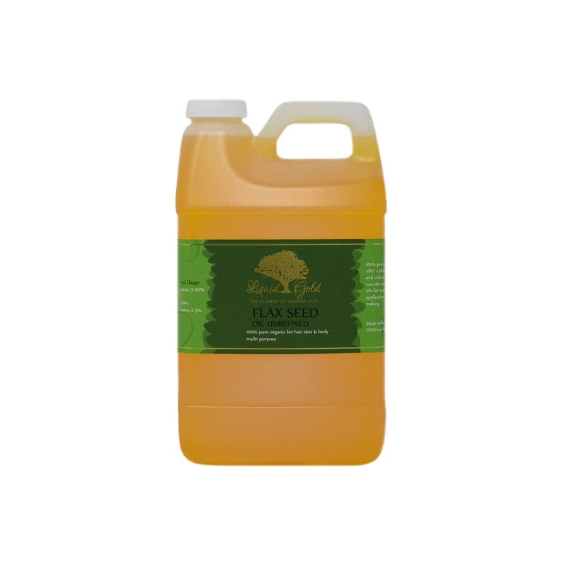May include: A gallon jug of Liquid Gold Flax Seed Oil, unrefined. The label is green with a gold tree and the text "Liquid Gold The Alchemy of Organic Oils Flax Seed Oil, Unrefined 100% pure organic for hair skin & body multi purpose"