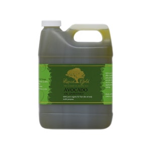 May include: A large, dark green plastic jug of Liquid Gold avocado oil. The label is green and gold, with the words "AVOCADO OIL UNREFINED" and "100% pure organic for hair skin & body multi purpose". The jug has a white cap and a handle.