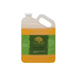 May include: A gallon jug of Liquid Gold Flax Seed Oil Unrefined. The label is green with a gold tree and the words "Liquid Gold" and "The Academy of Organic Oils". The label also says "100% pure organic for hair skin & body multi purpose".