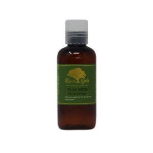 May include: A brown glass bottle with a clear plastic cap. The bottle is labeled "Liquid Gold" and "Flax Seed Oil Unrefined". The label is green with gold lettering and a tree illustration.