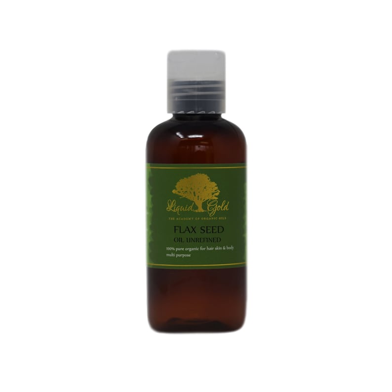 May include: A brown glass bottle with a clear plastic cap. The bottle is labeled "Liquid Gold" and "Flax Seed Oil Unrefined". The label is green with gold lettering and a tree illustration.