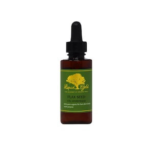 May include: A brown glass bottle with a dropper top filled with flax seed oil. The bottle has a green label with gold lettering that reads "Liquid Gold The Academy of Organic Oils Flax Seed Oil Unrefined 100% pure organic for hair skin & body multi purpose".