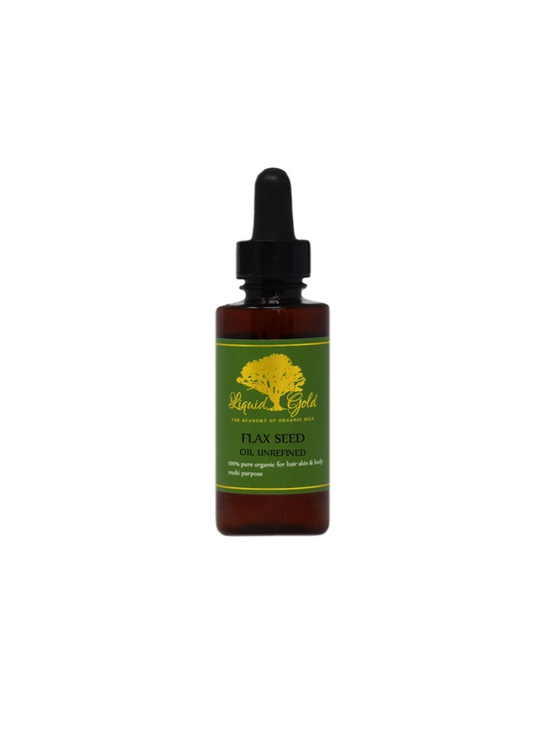 May include: A brown glass bottle with a dropper top filled with flax seed oil. The bottle has a green label with gold lettering that reads "Liquid Gold The Academy of Organic Oils Flax Seed Oil Unrefined 100% pure organic for hair skin & body multi purpose".