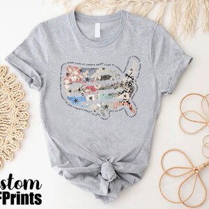 a t - shirt with a picture of a fish on it