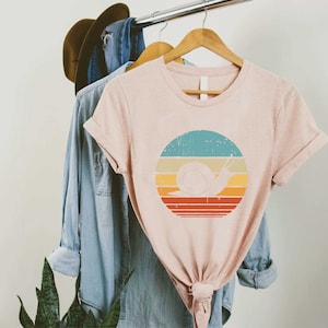 a t - shirt with a picture of a snail on it