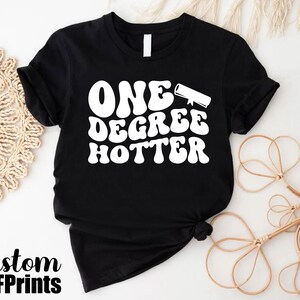 a black t - shirt with the words one degree potter printed on it