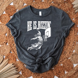 a t - shirt that says he is pizzan on it
