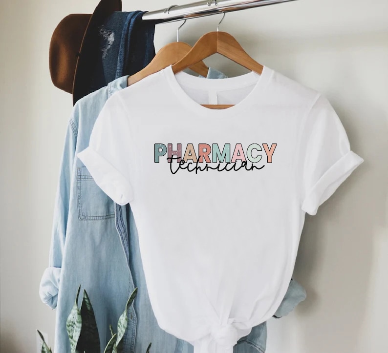 May include: White t-shirt with the text "PHARMACY Technician" in rainbow colors.