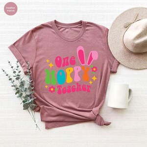 a t - shirt that says, one happy teacher